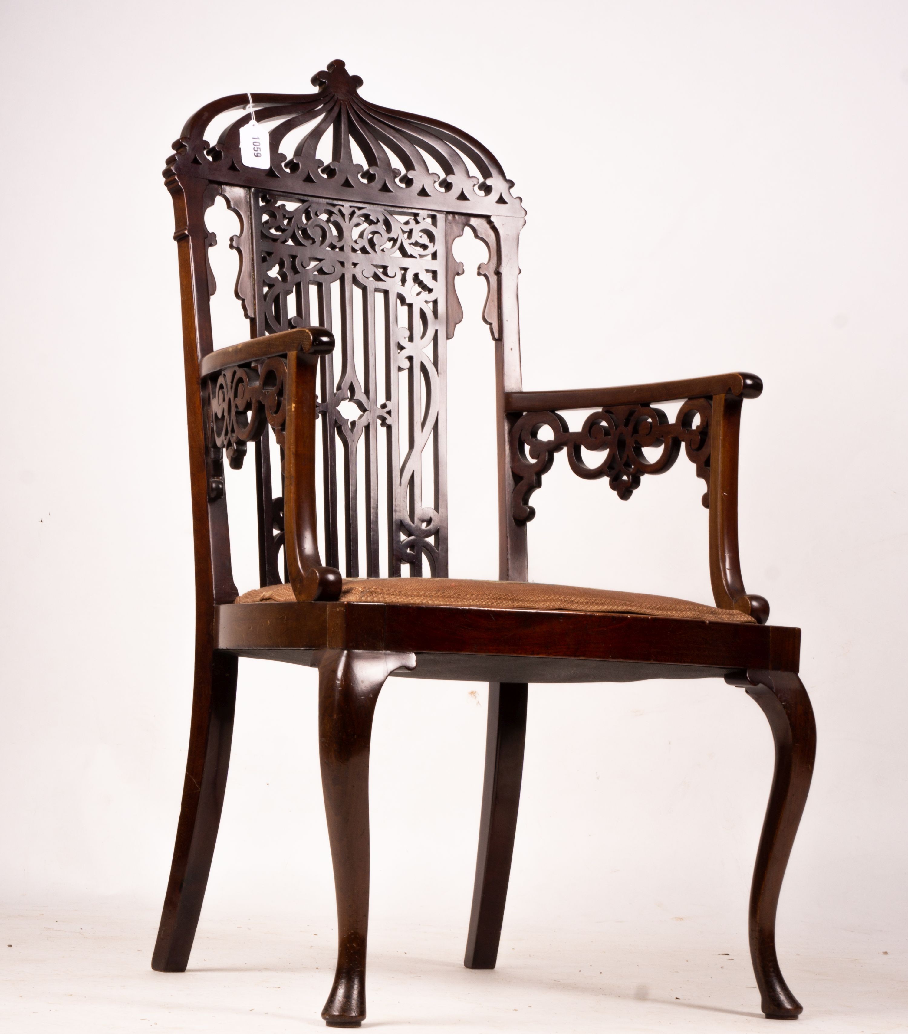 A late Victorian carved mahogany elbow chair